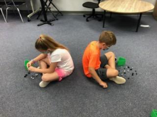 students building with legos