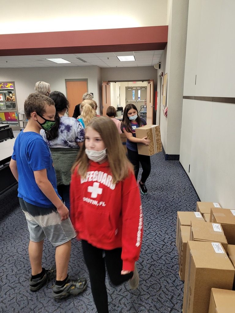 students moving boxes