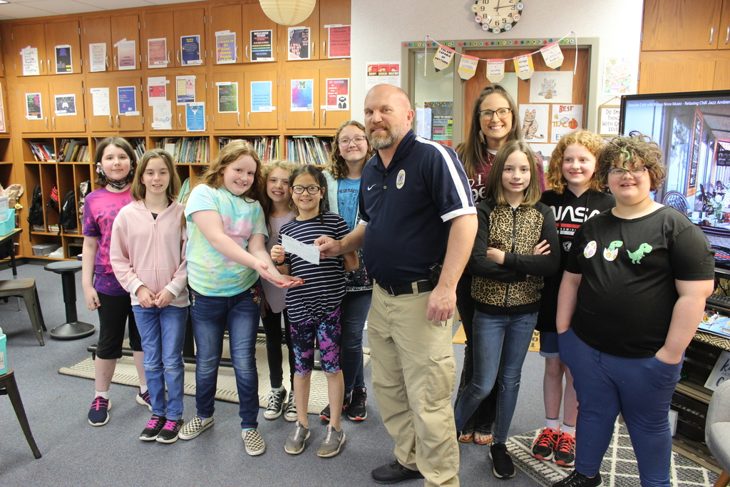 Kindness Cafe presents check to the MPD